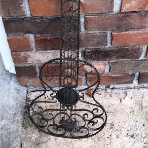 VTG wrought iron guitar wall hanger roughly measures 27” H